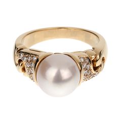 The Vintage Bvlgari Pearl Diamond Yellow Gold Ring is an exquisite piece of jewelry that exemplifies the luxurious craftsmanship and timeless elegance for which the Bvlgari brand is renowned. This stunning ring features a magnificent 9mm pearl as its centerpiece, radiating a soft and enchanting luster that captivates the eye. The pearl is flawlessly round, with a smooth and reflective surface that displays subtle hues of white and cream, adding to its mesmerizing beauty. Crafted from 18k yellow gold, the band of the ring is designed with a sophisticated and elegant aesthetic. The rich, warm tones of the yellow gold complement the pearl perfectly, creating a harmonious balance between the two elements. The band is meticulously polished to a high shine, enhancing its opulent appearance and m