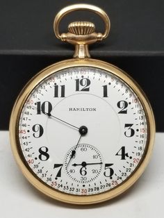 1920 Gold Filled Hamilton Pocket Watch, Grade 992, Size 16s, 21 Jewels, Works. Not timed for accuracy. Movement with, Hamilton Watch Co. Lancaster, PA., 21 Jewels, 992, Double Roller, Adjusted 5 Positions, 1552084. Inside back of case with, S.W.C. Co., Gold Filled, 20 Years, 4820126. Back of case engraved B E E. Dial looks good. Crystal with scratches. Case with minor wear to finish and scratches. Lever set and works fine. We do not test items to see how long or how accurate they run. All items we sell have had a previous owner(s). None, and I'll repeat it, none of our watches online are currently serviced unless they state so in the description. To get a watch overhauled (timing etcetera) it costs 3-400+ not including shipping both ways. If an Item that is listed states, "Running", it sim Classic Formal Watch Accessory With Stopwatch, Classic Round Stopwatch Watch, Classic Round Watch With Stopwatch, Classic Gold Stopwatch Watch Accessories, Classic Gold Watch Accessories With Stopwatch, Hamilton Watch, We Watch, Lancaster Pa, Pocket Watches