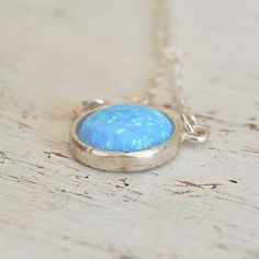 Blue Opal Pendant Necklace,Opal silver Necklace,Gemstone Necklace,Opal Necklace,Gift for Mom,Delicate Necklace,Blue Opal Necklace JewelrySpacial Gift!So dainty and classic tiny everyday opal necklace, great idea for Mother's Day.Beautiful 10mm lab opal pendant hangs on a delicate sterling silver chain .The Opal is October birthstone and considered to be the stone for luck :)This necklace is perfect for yourself, giving as a special gift, or bridesmaid necklaceSo simple and yet will be stunning on your neck!*Model wearing 16 inch length*Opal stone size- 10mm All my jewelry are packed in an elegant gift box.If you want to give it as a gift you can specify the address and I'll be happy to send it on your behalf. Opal Necklace Silver, Idea For Mother's Day, Blue Opal Necklace, Necklace Opal, Opal Pendant Necklace, Necklace Gemstone, Bridesmaid Necklace, Necklace Blue, October Birthstone