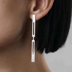 Minimal and elegant with a contemporary twist in design. New member to CONCORD family. This earring is designed to be worn in couple different ways. Made with secure closure on the bottom part it can be bend via hinge and close from the back of the ear. It can also have a more elegant version, when worn open and secured with standard silver earrings nut. You can choose to wear it as one or as a pair, please find more ways to style "aka jewellery" and share it with us! MATERIAL: - Available in si Architectural Earrings, Metal Art Jewelry, Contemporary Jewellery Designers, Earrings Aesthetic, Metalwork Jewelry, Contemporary Earrings, Art Jewelry Contemporary, Minimalist Studs, Classic Earrings