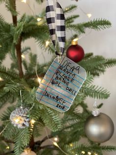 a christmas ornament hanging from the top of a tree