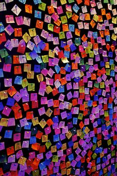 a wall covered in lots of colorful sticky notes