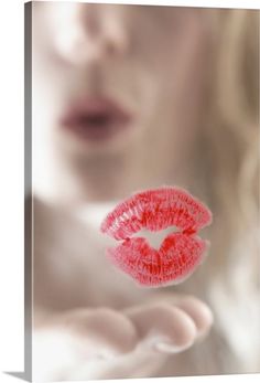 a woman's lips are red and the image is blurry