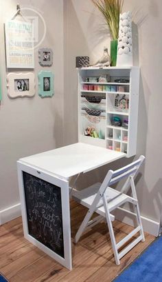 a white desk with a chalkboard underneath it