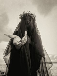 black and white photograph of a woman wearing a veil over her head