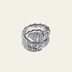 No jewelry lover’s collection is complete without Bulgari Serpenti. This Serpenti Viper Two-Coil Ring was made for the elegant connoisseur who favors the cool tones of 18-karat white gold and white diamonds. We love how comfortable the bold style feels when worn. Details 18k White Gold 2.77ct Diamond Size: Medium (U.S. Size 5.75-6.5) Ref 345226 Condition: Brand New *Comes with original box & authenticity card Luxury White Gold Snake Ring With Polished Finish, Bulgari Serpent Ring, Bvlgari Serpenti Ring, Bvlgari Serpenti Ring White Gold, Power Of Seduction, Bvlgari Serpenti Pendant, Bulgari Serpenti, Coil Ring, Bvlgari Serpenti