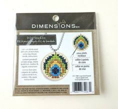 the cross stitch kit is in its package with instructions to make it look like an eye