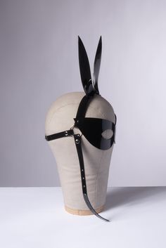 High quality, adorable bunny rabbit ears harness mask headpiece made in thick PVC, leather, or black vegan leather. Fit is adjustable with buckle in back of head. Shown in black, white, clear, and translucent red PVC Silver toned nickel plated steel hardware. Removable chin strap/buckle (snaps on and off with a heavy duty snap). SMALL/MEDIUM fits 20-23" head size.MEDIUM/LARGE fits 23-26" head size.Custom sizing available. All pieces are MADE TO ORDER. If your measurements fall outside these stan Back Of Head, Adorable Bunny, Gothic Accessories, Rabbit Ears, Black Vegan, Bunny Ears, Bunny Ear, Cute Bunny, Bunny Rabbit