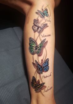 a woman's arm with butterflies on it and the names of her favorite authors