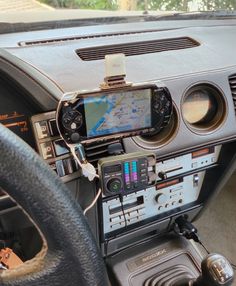 a car dashboard with an electronic device attached to it