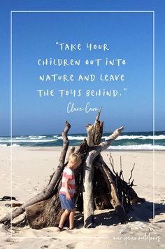 a little boy standing in front of a teepee on the beach with a quote about children out into nature and leave the toys behind