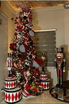 a christmas tree decorated with nutcrackers and ornaments