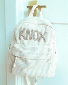 We're officially BACK TO SCHOOL!! And we have the cutest hand embroidered backpack for your little one :) Customized with name, designs, etc. we love the longevity you get out of this personalized item!  HOW TO ORDER: ---------------- - Choose backpack color  - # of letters in name - Cursive or BLOCK letters - yarn colors (specify by letter if needed) - Design or No Design All backpacks will vary slightly as embroidery is all done by hand.  We are at our full lead time of 4 weeks currently, plea Cute Cotton Backpack For Everyday Use, Cute Bags With Letter Embroidery For Everyday Use, Cute Everyday Cotton Backpack, Cute Bag With Letter Embroidery, Cute Letter Embroidery Bag, Cute Cotton Backpack For Back To School, School Backpack With Embroidered Patch, Embroidered Patch Backpack For Everyday Use, Custom Embroidery Backpack For Everyday Use