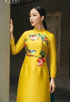 Beautiful Embroidered Gold Ao Dai  Very well made with high-quality taffeta fabric. This set includes the Ao Dai and a matching pants. It's Asian size, it may run out 1-2 smaller size than International Standard size. Please refer the size chart before purchasing Please provide your chest and waist measurement when placing your order so we can ensure the best fit for you. Please let me know if you need more information! Check out our other beautiful products at: https://www.etsy.com/shop/Theresa Silk Long Sleeve Ao Dai, Silk Sets With Gold Embroidery And Long Sleeves, Embroidered Fitted Set For Spring, Fitted Embroidered Sets For Spring, Fitted Embroidered Spring Sets, Embroidered Fitted Sets For Spring, Long Sleeve Cotton Ao Dai For Spring, Spring Long Sleeve Cotton Ao Dai, Spring Cotton Long Sleeve Ao Dai