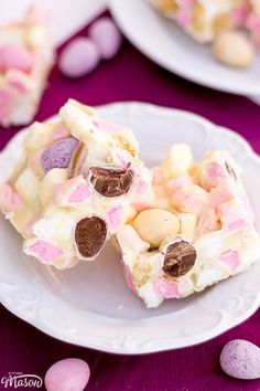 some kind of dessert on a plate with candy and marshmallows around it