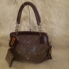 Add A Serious Dose Of Sparkle To Your Every Day Look With This Gorgeous Handbag. Has Back Zipper Pocket Double Handles With A 8 Inch Drop Length Detachable Strap With A 22 Inch Drop Length Made Of Faux Leather Construction Fully Lined Interior Two Interior Slip Pockets And One Zippered Pocket An A Center Zipper Divider Compartment Top Zipper Closure Silver Hardware Includes Matching Wristlet Coin Purse, 5.5lx4h Silver Bags With Rhinestones For Everyday Use, Formal Silver Shoulder Bag With Bling, Silver Bling Bags For Night Out, Silver Bags With Rhinestones, Silver Rhinestone Shoulder Bag For Everyday, Formal Silver Shoulder Bag With Rhinestones, Silver Rhinestone Shoulder Bag For Night Out, Glamorous Silver Shoulder Bag With Bling, Everyday Silver Rhinestone Shoulder Bag