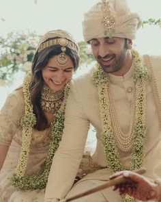 a bride and groom cutting their wedding cake