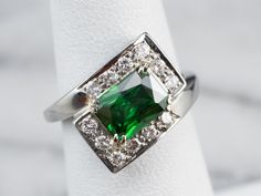 This modern bypass ring can be worn as an engagement, anniversary, or everyday ring. The bright, glowing 18 karat white gold sets off this unusual, emerald-colored stone quite well! We've set this ring with a new, bright green Tsavorite Garnet. Mined in Africa, Tsavorite was named for Tsavo National Park, in Kenya. Surrounded by high-quality diamonds this stunning garnet ring is sure to be an instant favorite! Metal: 18K White Gold Gem: Tsavorite Garnet 2.59 Carats Gem Measurements: 5.7 x 7.8 mm Gold Garnet Ring, Yellow Gold Sapphire Ring, Diamond Ring Gold, Garnet And Diamond Ring, Garnet Engagement Ring, Tsavorite Garnet, Everyday Ring, White Gold Set, Bypass Ring