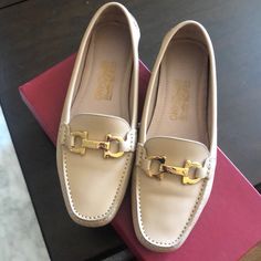 In Great Condition. Used About Three Times. Calfskin Leather With Gold Hardware. Comes With Box And Dust Bag. Elegant Moccasins With Rubber Sole For Galas, Formal Beige Moccasins With Leather Sole, Luxury Beige Loafers For Work, Luxury Beige Loafers For Office, Elegant Almond Toe Moccasins For Galas, Luxury Flat Heel Moccasins For Galas, Elegant Beige Moccasins With Removable Insole, Beige Formal Loafers With Leather Lining, Elegant Leather Moccasins With Removable Insole