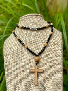 Handmade beaded necklace, cross necklace, glass and wood beads  The necklace is NOT adjustable, the size of the necklace is approx 19inches    -glass beads-3mm    -antique bronze beads-3mm    -wooded bead with cross-8mm    -natural wood beads-8x4mm    -wood cross approx-6cm All our items are made by us,we don't sell anything that we haven't made. Custom orders are welcome, please contact us if you have any question. ➡️All Orders Ship SAME or NEXT Day❗️ * All UK items are sent standard royal mail Adjustable Cross Jewelry With Wooden Beads, Adjustable Cross Necklace With Wooden Beads, Adjustable Wooden Beads Cross Jewelry, Adjustable Cross Necklace With 8mm Beads, Handmade Adjustable Black Cross Necklace, Adjustable Cross Necklace With Black Beads, Adjustable Black Beads Cross Necklace, Brown Cross Necklace With Wooden Beads, Brown Wooden Beads Cross Necklace