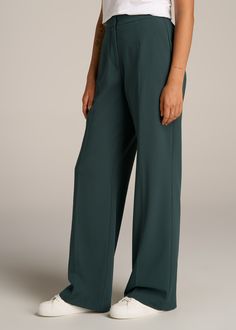 About Our Flat Front Wide Leg Dress Pants for Tall Women Ultra-flattering and easy to wear, these women's tall dress pants are a closet essential. They feature a smooth front with a contoured waistband for a complimentary finish. Pleated accents at the front and back elongate your legs and make them easy to wear from the desk to dinner. Built with a stretch-infused polyester-viscose blend, these pants for tall women offer the sleek feel of a suit with the comfort of a lounge pant. An elastic at Green Wide Leg Pants For Formal Fall Occasions, Formal Green Wide Leg Pants For Fall, Loosely Fitted Full Length Solid Dress Pants, Elegant Business Casual Dress Pants With Elastic Waistband, Tailored Green Wide Leg Pants For Formal Occasions, Relaxed Fit Elastane Wide Leg Pants For Work, Elegant Green Wide Leg Pants With Elastic Waistband, Semi-formal Solid Color Wide-leg Pants, Solid Elastic Waistband Dress Pants For Business Casual