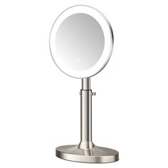 a round mirror sitting on top of a metal stand