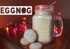 a jar filled with cookies sitting on top of a wooden table