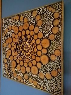 a large piece of wood that has been cut into smaller pieces and is hanging on the wall