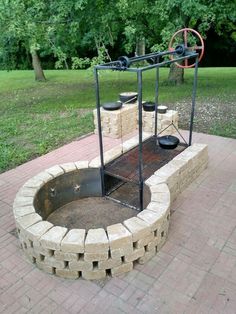 an outdoor fire pit made out of bricks