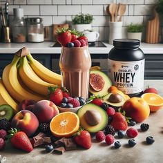 various fruits, berries, avocado, and chocolate shake on a kitchen counter