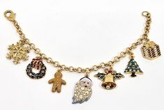 Christmas Charm Bracelet Gold Plated Metal Alloy Set With Enamel And Sparkling Austrian Crystals This whimsical gold plated bracelet features 7 Christmas themed charms, including a Christmas tree, a present and a wreath, and has a lobster claw fastening.  This festive bracelet would make an ideal Christmas gift.       *    Gold plated charm bracelet set with Austrian crystals and enamel     *    A collectable Christmas themed woman's charm bracelet     *    Supplied in a Gift Box with a Certific Gold Christmas Festive Bracelets, Holiday Festive Jewelry Bracelet, Elegant Gold Christmas Bracelets, Elegant Gold Bracelets For Christmas, Gold Jewelry For Festive Holiday Occasions, Gold Christmas Jewelry With Charms, Christmas Gold Jewelry With Charms, Gold Jewelry With Charms For Christmas, Gold Jewelry For New Year Party