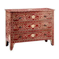 a red and white chest with two drawers on one side and an ornate design on the other