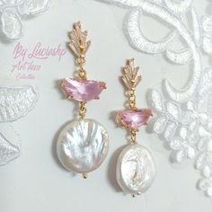 Looking for the perfect statement earrings for your wedding day? These Pearl Bridal Earrings with Pink Art Deco details are perfect for the boho bride who wants to add a touch of elegance to her look. With natural pearls and a long dangle design, these earrings are sure to make a statement on your big day.     They're also a great gift for bridesmaids or for any special occasion. MATERIALS: Brass gold plated 14k                        Pink Crystal faceted                        Clear Zircon AAA Elegant Handmade Crystal Earrings For Wedding, Elegant Handmade Crystal Wedding Earrings, Pink Elegant Clip-on Earrings For Anniversary, Handmade Pink Crystal Earrings For Wedding, Elegant Pink Round Chandelier Earrings, Elegant Pink Clip-on Earrings For Anniversary, Pink Round Chandelier Earrings For Wedding, Pink Chandelier Earrings For Wedding, Handmade Pink Bridal Earrings For Wedding