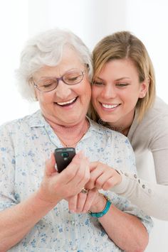 an older woman hugging her younger lady - stock photo - images