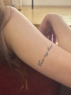 a woman with a tattoo on her arm that reads, you are my forever and i am yours