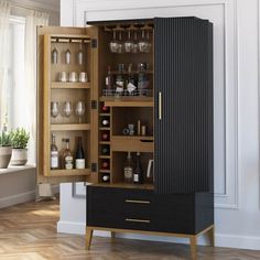 an armoire with wine glasses and bottles in it