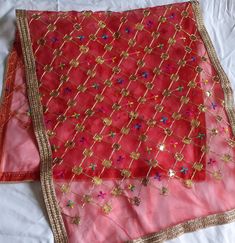 Fabric: Net Golden Thread Work. Golden Heavy Border Heavy Golden Embroidery on Chunari. Multipurpose Dupatta. It can be use for bridal Dupatta, Karwachauth Dupatta. Chunri is an integral part of festivities. It is draped on head and shoulders like a scarf by women during religious functions, ceremonies and prayer rituals. It is draped around deity Idols and altars and thus made from auspicious colors Mata Ki Chunari/Navratri Chunni For Kanya Pujan/Devi Mata Full Jari Chunari/Durga Devi Chunni Wi Gold Bandhani Print Traditional Wear For Navratri, Gold Bandhani Traditional Wear For Navratri, Multicolor Wedding Churidar With Dori Work, Multicolor Gota Work Choli For Puja, Multicolor Gota Work Churidar For Wedding, Multicolor Churidar With Gota Work For Wedding, Traditional Shantoon Churidar For Festive Occasions, Red Bandhani Print Sharara For Puja, Festive Traditional Shantoon Churidar