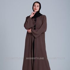 Embrace The Timeless Allure Of Our Cascading Elegance Abaya, A Perfect Fusion Of Grace And Contemporary Style. Crafted From Rich Brown And Black Fabrics, This Abaya Exudes Sophistication. Here's Why It's A Wardrobe Essential: Matching Hijab: This Abaya Comes With A Matching Hijab No More Searching For The Perfect Match, We've Taken Care Of It For You. Buy A Complete Abaya Look Today. Size L - Length 56 Inches Size Xl- Length 58 Inches Graceful Cascade: The Fabric Drapes Gracefully, Creating A Ca Elegant Brown Thobe For Eid, Long Brown Dress For Eid, Long Brown Dresses For Eid, Brown Long Dress For Eid, Modest Long Brown Maxi Dress, Brown Long Thobe For Eid, Elegant Long Sleeve Brown Kaftan, Modest Brown Abaya For Eid, Elegant Brown Long Sleeve Kaftan