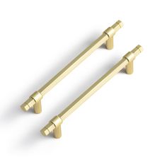 two brass handles on a white background