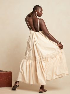 A double row of intricate shirring adds texture to this poplin maxi dress.  Versatile and expertly tailored, this swing style instantly changes shape with the simple addition of a belt (or two).  SWING FIT: Cut for a flowing, A-line fit.  No waist de Backless Dress Summer, Cotton Gowns, Backless Maxi Dress, Shades Of Beige, Backless Maxi Dresses, Banana Republic Dress, Swim Cover, Linen Dresses, Skirts With Pockets