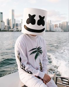 a person wearing a marshmallow hat sitting on a boat