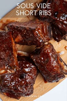 ribs on a cutting board with text overlay that reads sous vide short ribs