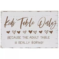 a sign that says, kids table only because the adult table is really boring