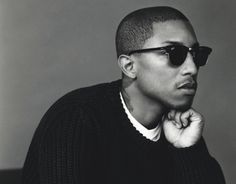 a man wearing sunglasses and a sweater