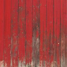 an old red wooden wall with peeling paint