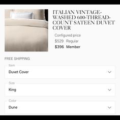 a bed with white sheets and pillows on it, in the store's website