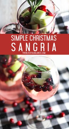 two glasses filled with sanggraa and garnished with apples, cranberries, and rosemary