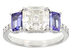 Moissanite Fire(R) 3.08ctw diamond equivalent weight asscher cut and round with .85ctw octagonal cut tanzanite, Platineve(R) ring. Measures approximately 5/16" L x 1/16" W and is not sizeable. Actual moissanite weight is 2.37ctw. Comes with certificate of authenticity. Luxury Asscher Cut Sapphire Ring, Tanzanite Asscher Cut Ring With Prong Setting, Brilliant Cut Octagon Sapphire Ring In Platinum, Platinum Diamond Ring With Asscher Cut Gemstone, Asscher Cut Diamond Ring In Platinum, Asscher Cut Diamond Platinum Ring, Asscher Cut Diamond Ring With Gemstone, Dazzling Asscher Cut Diamond Ring, Gia Certified Asscher Cut Sapphire Ring