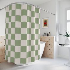 a green and white checkered shower curtain next to a bathtub in a bathroom