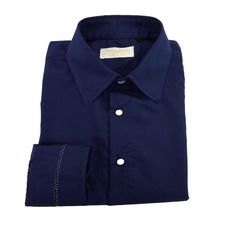 The elegance of the sartorial shirt with Italian collar, which immediately enhances the style of the wearer. Provided with Italian collar, back yoke with two high pleats and straight cuffs with particular central silver-colored stitching. Regular fit.  Fabric: stretch cotton 97% cotton, 3% elastane, blue color 101b011 from the color chart. Hand wash warm water 30 - 40 degrees. Do not bleach. Do not tumble dry. Lukewarm iron max 110 degrees c. Dry clean delicate with perchlorethylene. Do not professional wet clean. Line dry in the shade.  All our items are handmade and packaged one at a time, designed and produced in limited quantities in our laboratory in Irsina (MT) in Italy with exclusively MADE IN ITALY fine fabrics.  This item is put into production after your order, following your mea Navy Cotton Dress Shirt For Business, Classic Navy Cotton Dress Shirt, Blue Cotton Dress Shirt For Business Casual, Blue Dress Shirt With Placket For Office, Blue Office Dress Shirt With Placket, Designer Blue Shirt With Spread Collar, Designer Blue Shirt For Formal Occasions, Blue Business Shirt With Spread Collar, Blue Dress Shirt With Placket For Work